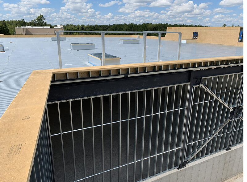 Rooftop parapet framing with roof membrane installed